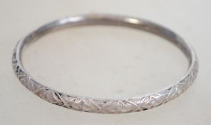 A sterling silver bangle bracelet of circular form