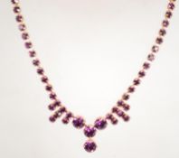 A vintage 1950s rhinestone necklace in a gold tone