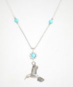 A sterling silver necklace chain set with turquois