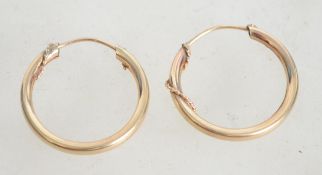 A pair of 9ct gold ladies hoop earrings having a r