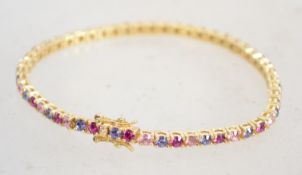 A gilt silver tennis bracelet being set with alter