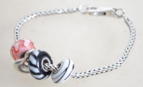 A sterling silver fox tail link bracelet chain wit