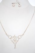 A silver and moonstone necklace and earrings demi-