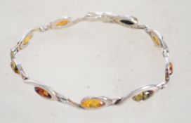 A sterling silver bracelet having coloured amber t