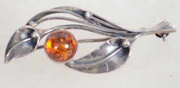 A sterling 925 silver and amber leaf brooch having