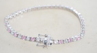 A sterling silver and CZ tennis bracelet having al