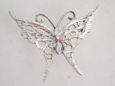 A sterling silver butterfly brooch with pin to ver