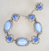 A heavy 1960s bracelet having blue rhinestones and
