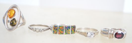 A group of 5 sterling silver dress rings one havin