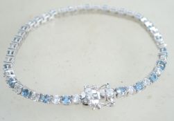 A sterling silver and CZ tennis bracelet having al