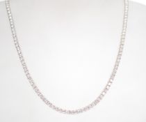 A sterling silver and CZ tennis necklace set with