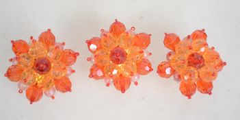 Three vintage 1960s plastic crystal cluster brooch