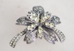 A marcasite and green rhinestone floral spray broo