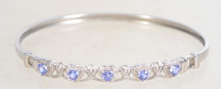 A sterling silver and CZ bangle bracelet having he