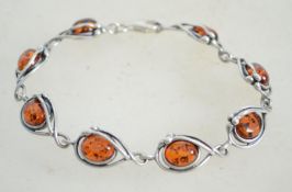 A sterling silver and amber bracelet chain having