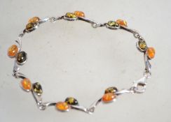A sterling silver and amber bracelet set with ambe