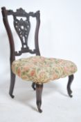 A Victorian aesthetic movement mahogany nursing ch