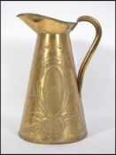 A 19th century Arts & Crafts brass jug being cast