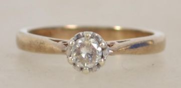 A ladies 9ct gold and diamond ring having a centra