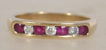 A 9ct gold hallmarked 7 stone ring set with 3 roun