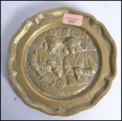 An unusual Flemish continental brass plate charger