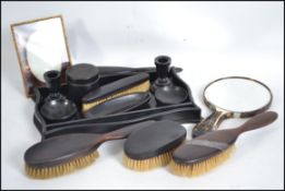A 20th century ebonised ladies dressing table set