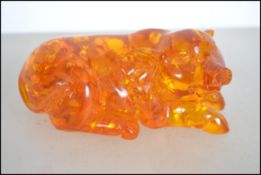 A 20th century sculpture of a pig being carved fro