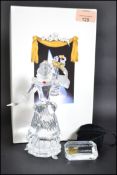 A Swarovski crystal glass SCS 2000 Columbine figur