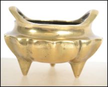 An 20th century Chinese bronze tripod censor, of b