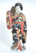 A large 1930's ceramic tall figurine of a Japanese