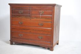 An Edwardian  walnut cottage  chest of drawers wit