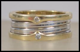 A Bvlgari large yellow and white gold band ring in