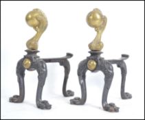 A pair of Victorian brass fire side dogs of unusua