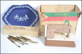 A vintage childs ' sewhandy ' Singer sewing machin
