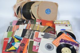 A collection of 45rpm vinyl single records dating