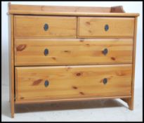 A contemporary pine 2 over 2 chest of drawers havi
