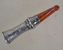A silver hallmarked and amber cheroot being chase