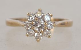 A 9ct gold and diamond flower head cluster ring ap