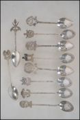 A collection of Malaysian - Asiatic silver teaspoo