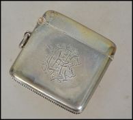 A silver hallmarked vesta with central monogram be
