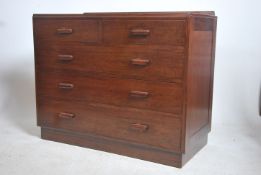 A 1940's Air Ministry mahogany chest being raised