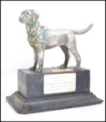 A silver plated on brass model of a Labrador dog,
