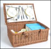 A retro 20th century vintage wicker picnic hamper