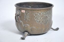 A 19th century copper coal / log box raised on hai