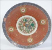 A large Chinese porcelain wall charger and central