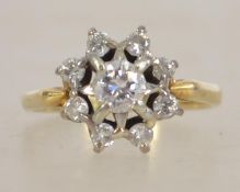 An 18ct gold and diamond ring having starburst mou