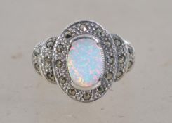 An Art Deco style ring set with a central opal and