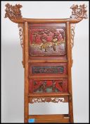 An early 20th century Oriental lacquered pine fold