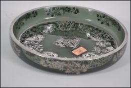 A large silver overlay green glass dish, possibly