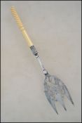 An unusual 19th century silver plated bread fork b